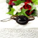 Vintage garnet bangle with big oval cabouchon in Victorian style