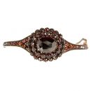 Vintage garnet bangle with an oval  facetted center stone