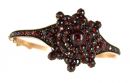Vintage garnet bangle with a larger garnet star on top